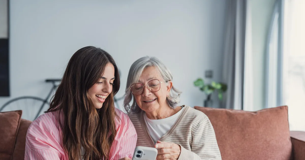 Elderly parent enjoying a conversation with the Amara voice companion app